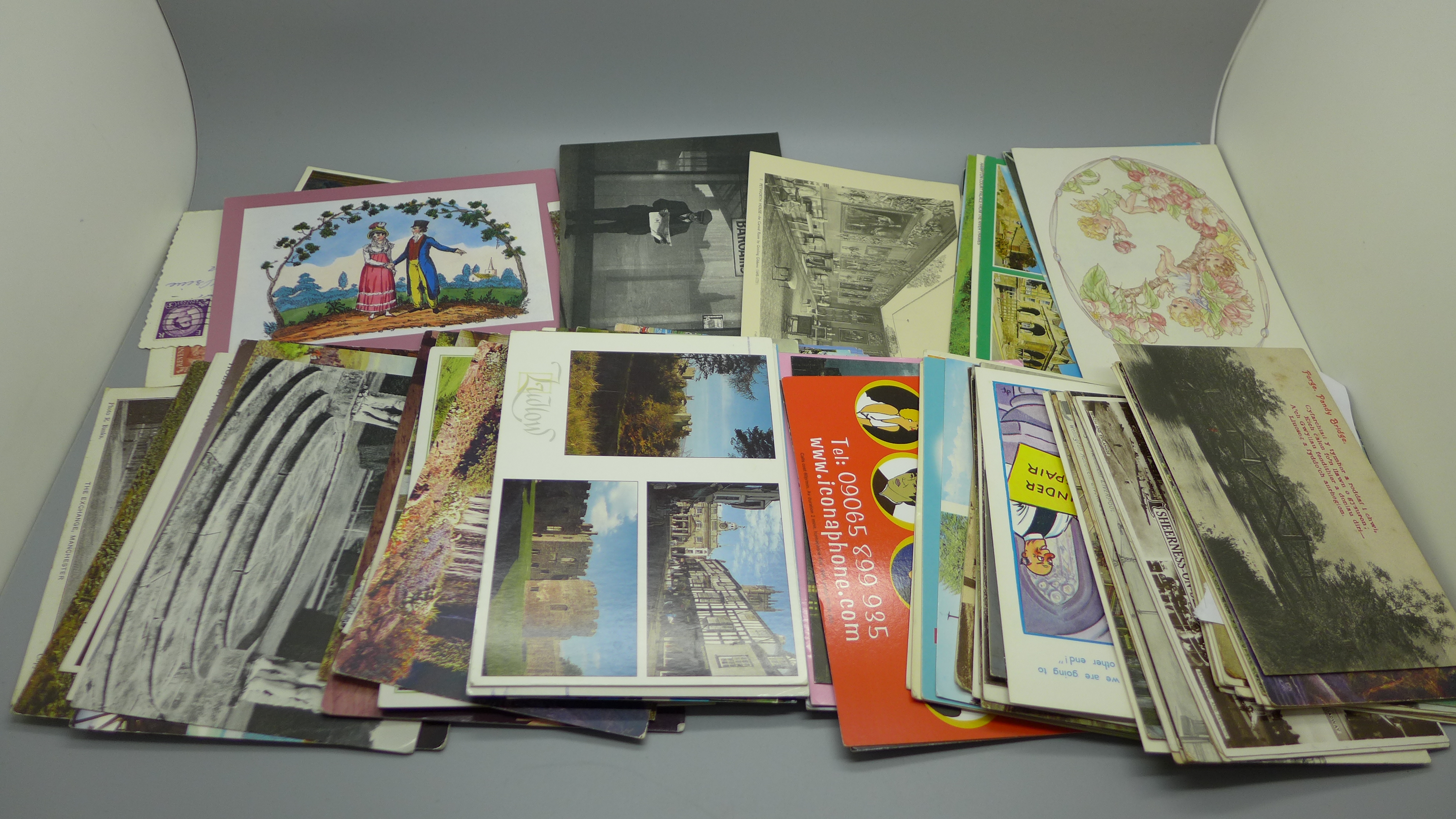 Over 100 Edwardian and later postcards, some postally used