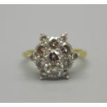 An 18ct gold and diamond cluster ring, 4.2g, O, set with thirteen diamonds, the centre stone