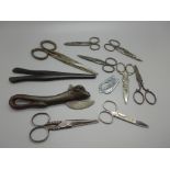 A bag of mixed scissors, 19th and 20th Century, a can opener and glove stretchers