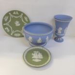Four items of Wedgwood Jasperware including The Hours vase and fruit bowl