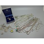 A silver heart necklace and earrings, a silver neck chain with large silver swivel fob pendant, a