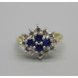 An 18ct gold, sapphire and diamond cluster ring, 3.4g, L