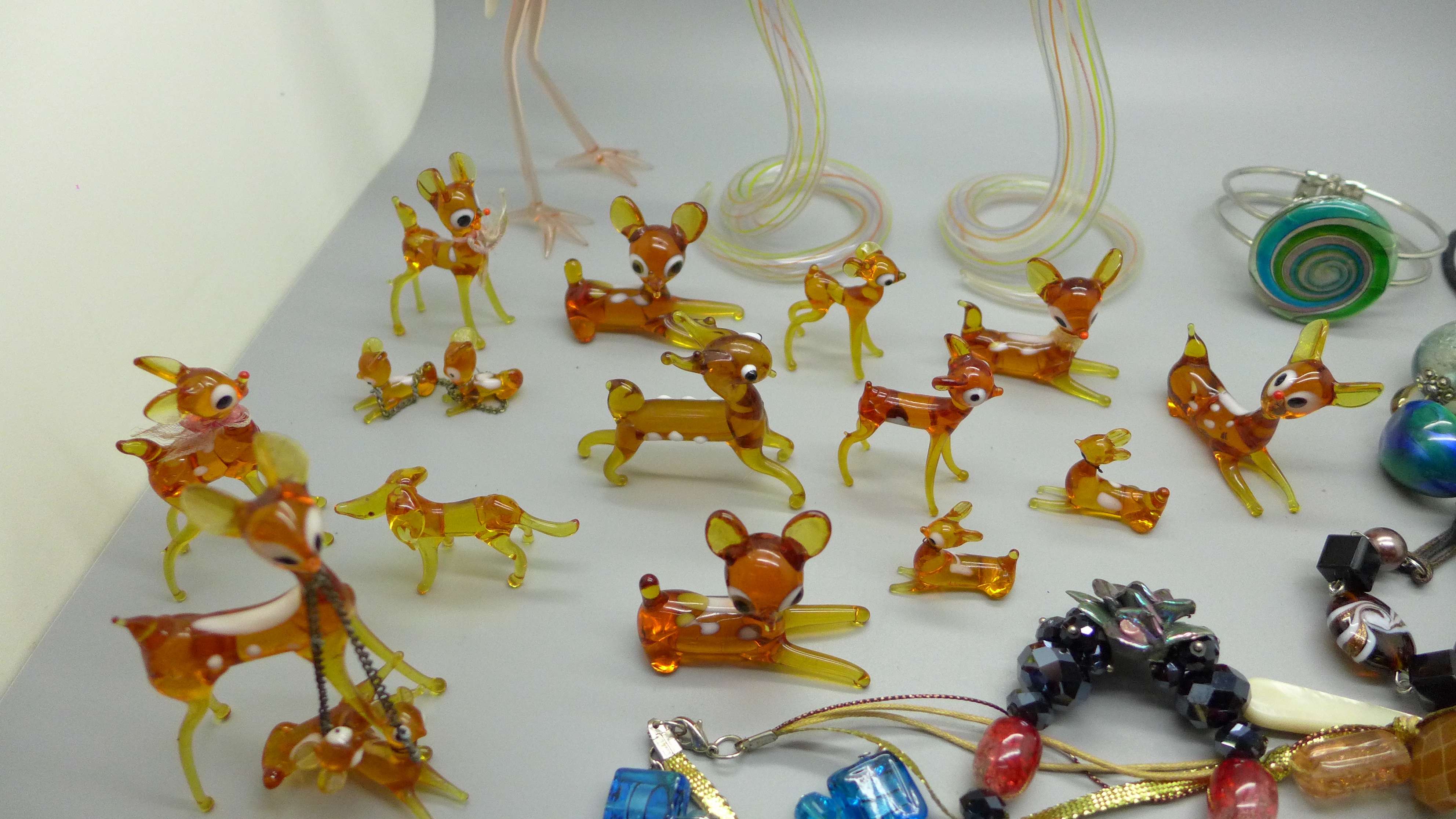 Sixteen deer, one dog, two hollow glass snakes and one flamingo glass animals and various glass bead - Image 2 of 4