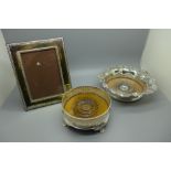 A 19th Century plated wine coaster with silver centre, a plated wine coaster and a plated photograph