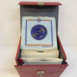 A collection of 1960's 7" vinyl records and case