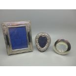 Three silver photograph frames, largest 10cm x 13cm