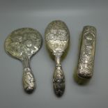 A silver mirror and brush set, decorated with Reynolds Angels, Birmingham 1911, (3)