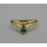 A 14k gold, emerald and zircon ring, 1.8g, L