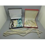 A collection of vintage necklaces including pearls