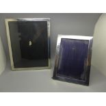 Two silver photograph frames, largest 20cm x 25cm and lacking back stand