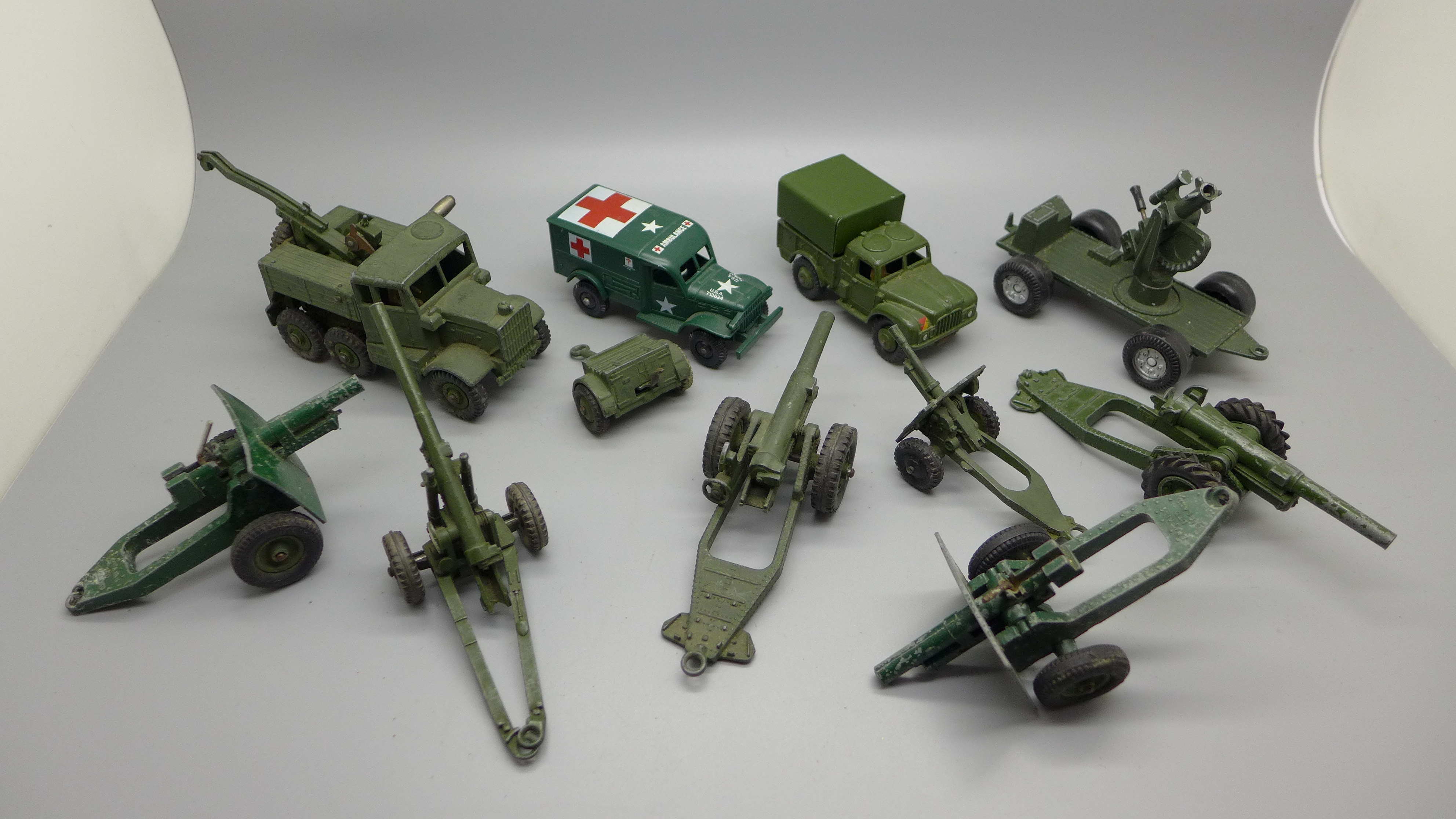 A collection of Dinky Toys die-cast Field Guns and other military vehicles