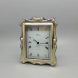 A silver fronted clock, marked R. Carr, height 12.5cm