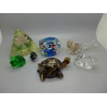 A collection of seven glass paperweights including animals