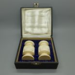 A carved Meerschaum salt and pepper pair, cased