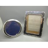 A rectangular silver photograph frame, 13.5cm x 18cm, and a circular silver photograph frame,
