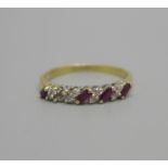 A 9ct gold, ruby and diamond ring, lacking one ruby, 2.6g, Q
