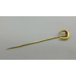 An Edwardian horseshoe tie or collar pin, tested as 18ct gold, 1.1g