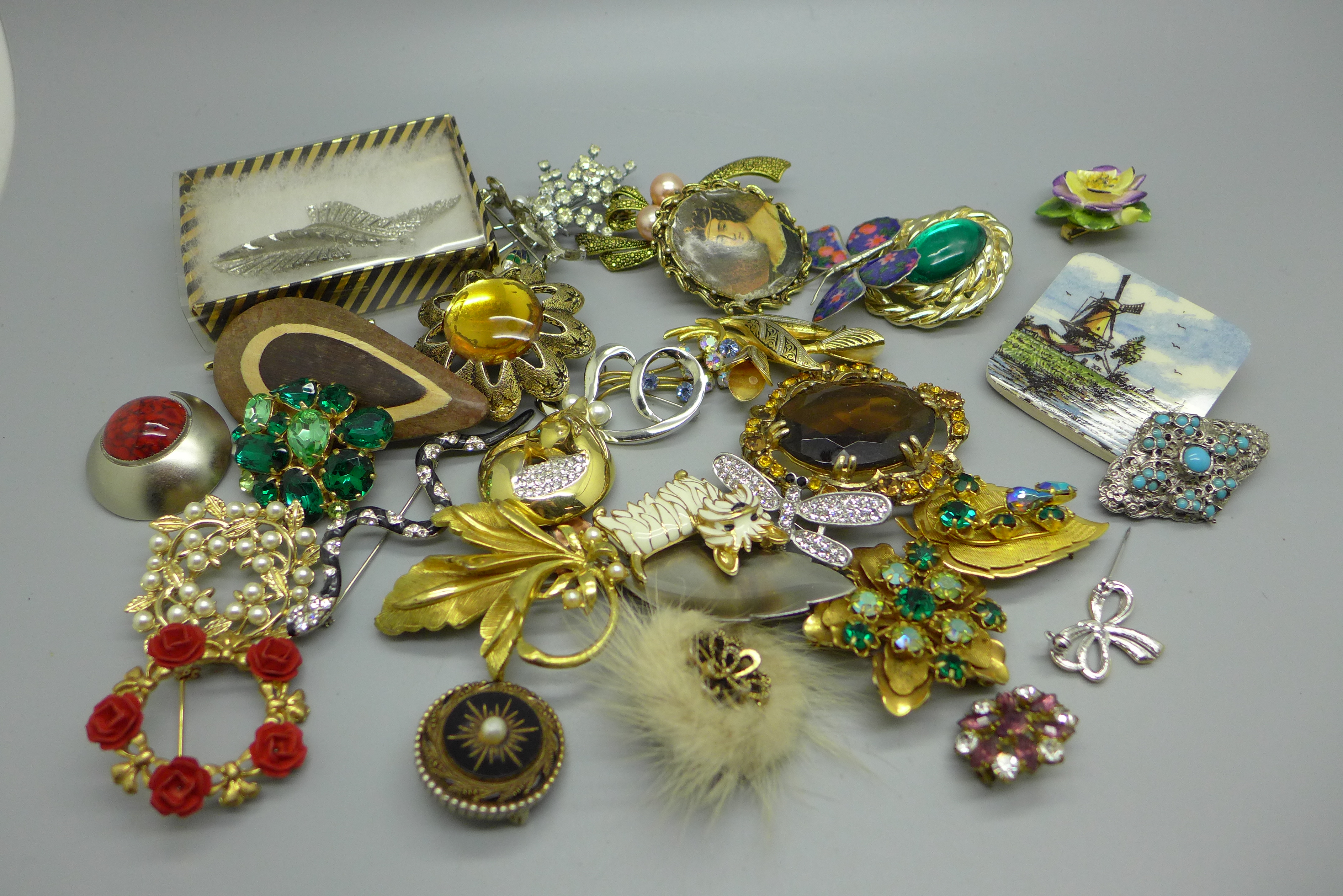 A collection of thirty-six costume brooches