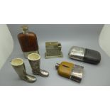Three hip flasks, with silver plated cups, two Wellington boot match holders and a Myflam table