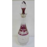 A ruby flash cut crystal decanter with silver top