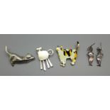 Two silver cat brooches, one other cat brooch and a pair of silver cat earrings