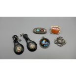 Jewellery; a silver brooch by Charles Horner, lacking hook, two other brooches, a silver and
