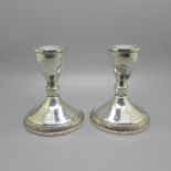 A pair of silver dwarf candlesticks, height 9.5cm