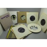 Seventeen The Beatles and solo 7" singles and a Beatles plate