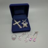 A collection of silver jewellery including two cross pendants