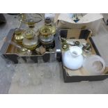 Assorted brass oil lamps, chimneys and shades