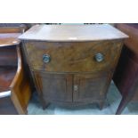 A small George IV mahogany two door side cupboard