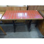 A cast iron based and tiled top pub table