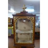 An 18th Century French stained pine and gilt gesso table top cabinet