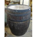 A large coopered oak wine barrel