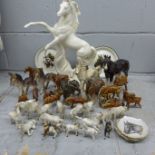 A collection of ceramic horse figures