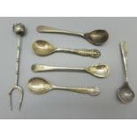 Five silver salt spoons and an oriental silver two pronged fork with control marks