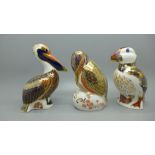 Three Royal Crown Derby paperweights, puffin, pelican and one more