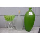 A green glass vase, a green glass centrepiece and a bottle marked Bottega