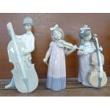 Three figures of musicians; Lladro boy, a/f, and two Nao girls, one lacking bow