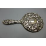 A silver backed hand mirror