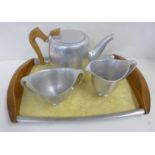 A three piece Picquot Ware tea set and tray
