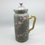 A 19th Century pewter lidded jug, embossed with cherry blossom