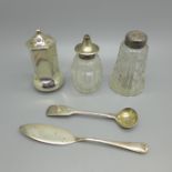 Three peppers, one silver and two silver topped, a silver butter knife and and a Victorian silver