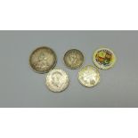 Two 1919 Canada 10 cents coins, a 1935 sixpence, a 1911 Australia one shilling and an enamelled 1887