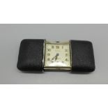 A Movado Art Deco silver and skin handbag watch, London import mark for 1928