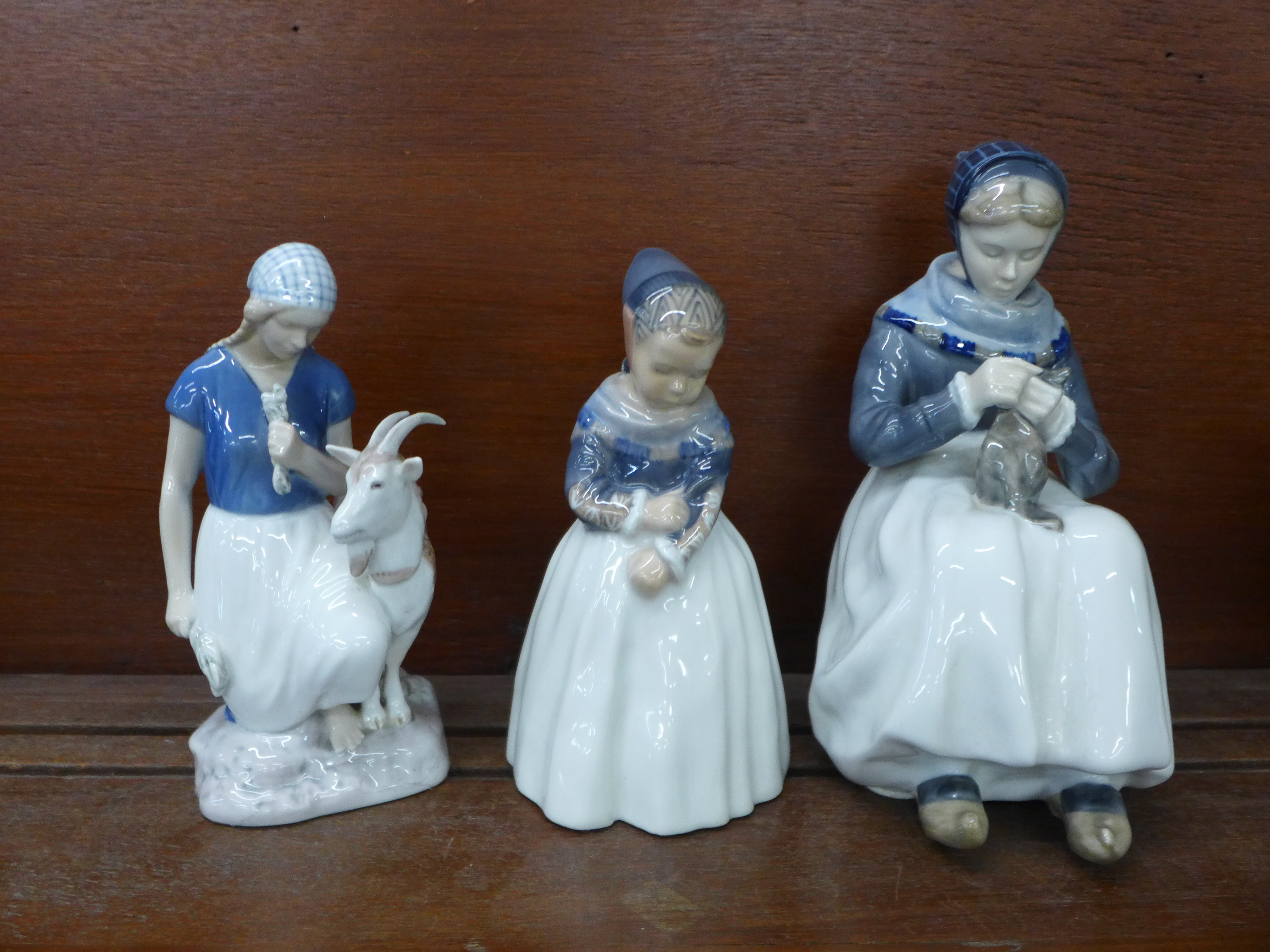 Two Royal Copenhagen figures of Dutch girls and one other Danish Bing & Grondahl figure of a girl