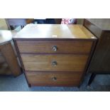 A teak chest of drawers