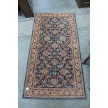 A small blue ground rug