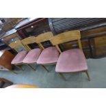 A set of four teak dining chairs