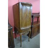 A North European mahogany cocktail cabinet on stand